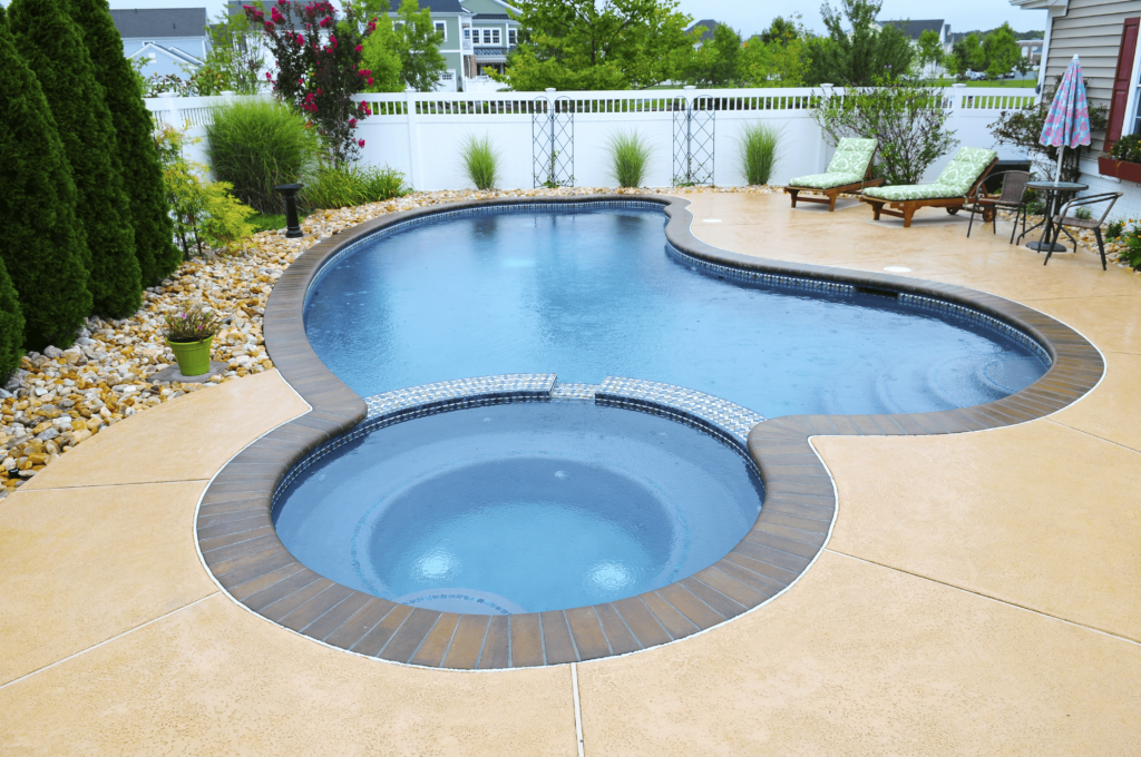 an inground swimming pool in a backyard