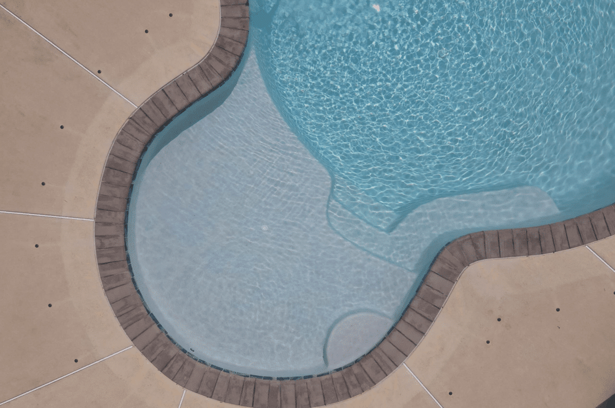 sun shelf in an inground swimming pool